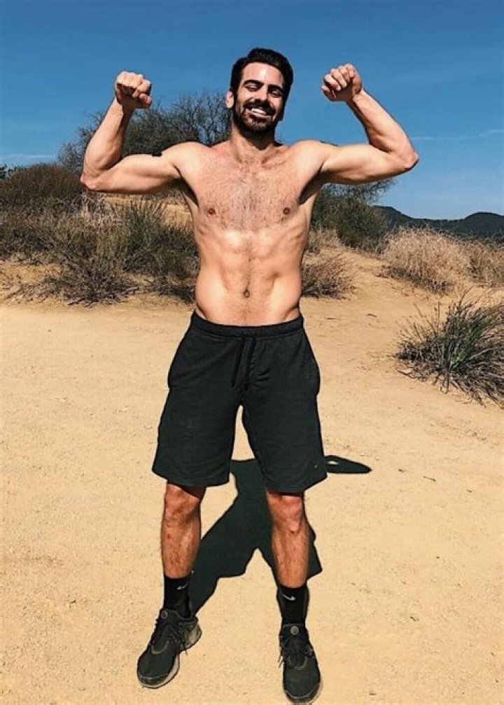 Nyle DiMarco showing his toned physique in Malibu, California in February 2018