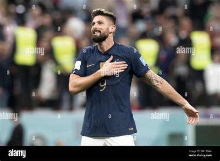 Olivier Giroud celebrating during the Arsenal FA Cup Parade in 2015