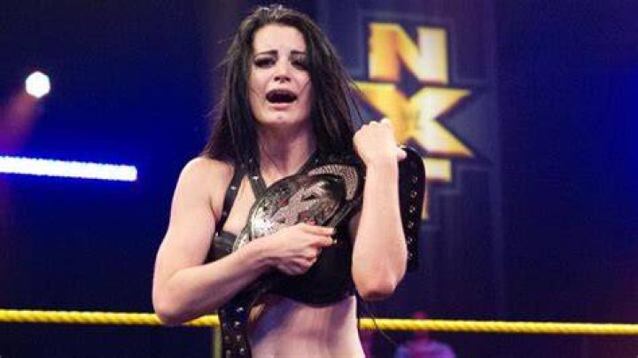 Paige with her NXT title during a photoshoot