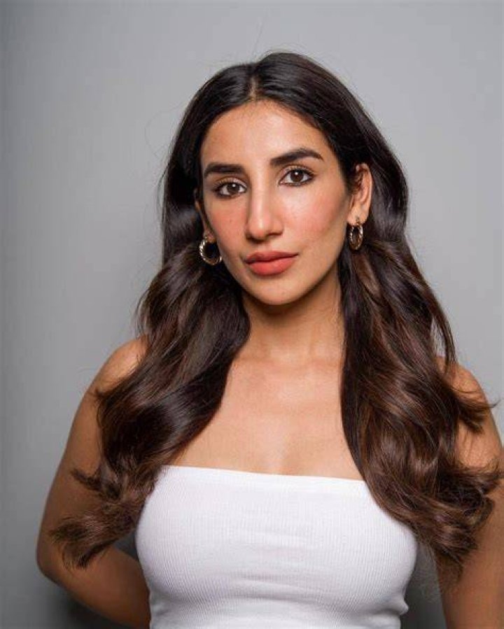 Parul Gulati smiling for a picture while showing her new hairstyle in March 2023