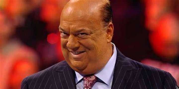 Paul Heyman as seen in a picture raising the hand of Brock Lessner in April 2014