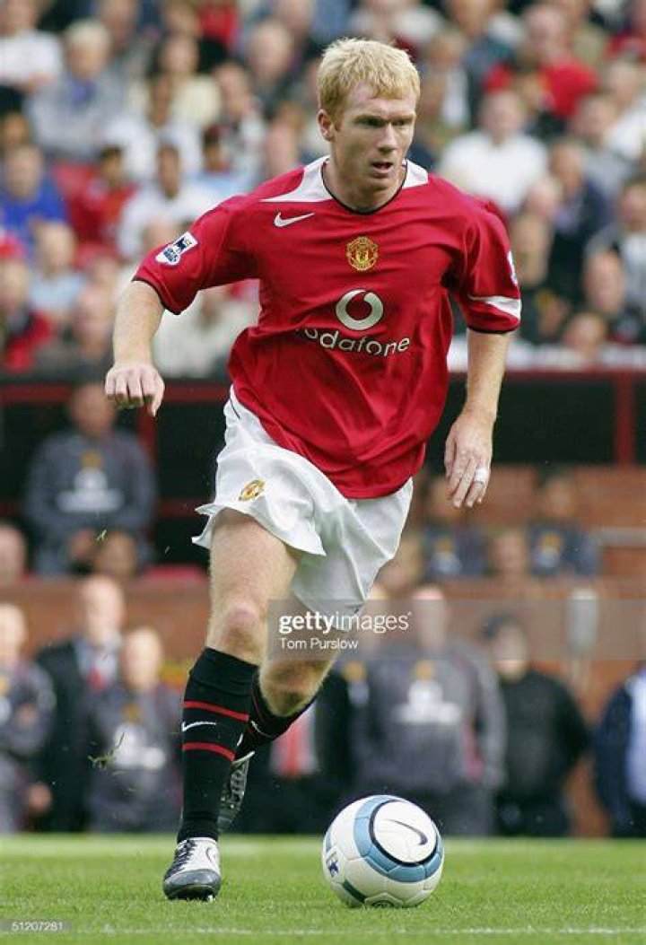 Paul Scholes in action for Manchester United during Premier League match at Old Trafford in 2011