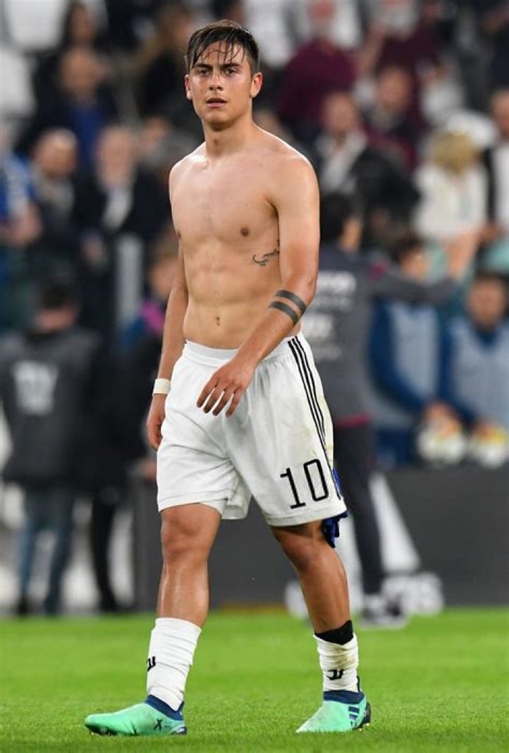 Paulo Dybala shirtless on football ground in May 2015