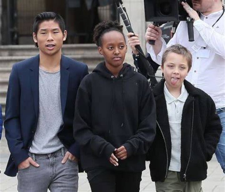 Pax seen with his siblings Zahara and Knox L&eacute;on