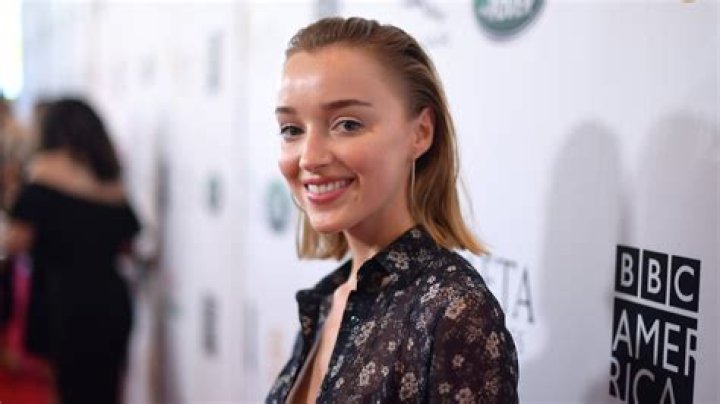 Phoebe Dynevor (Right) posing for a picture in New York City, New York