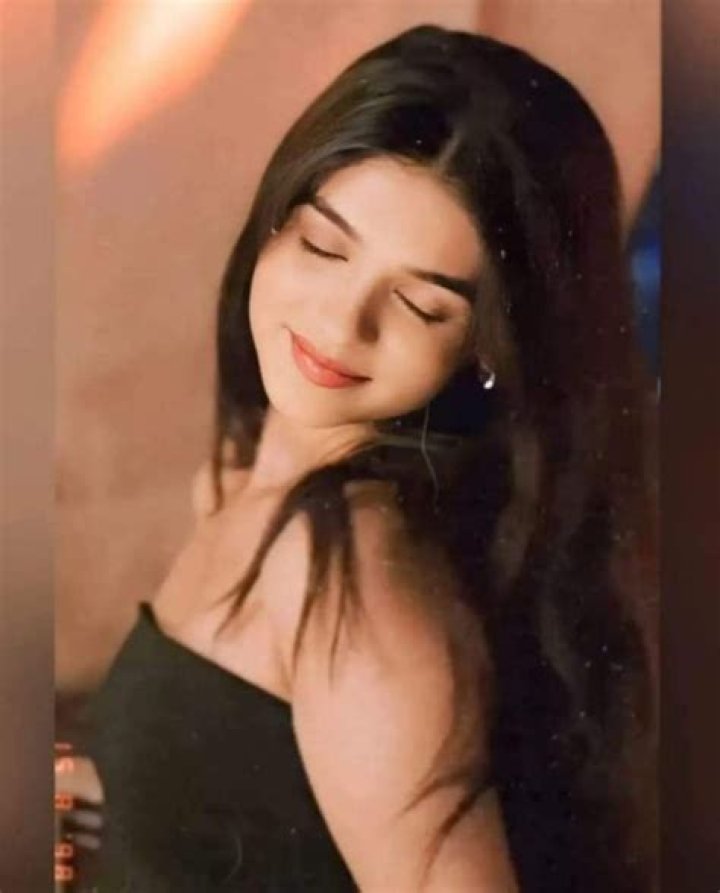 Pranali Rathod posing for a picture by a beach while enjoying a beautiful sunset in March 2021