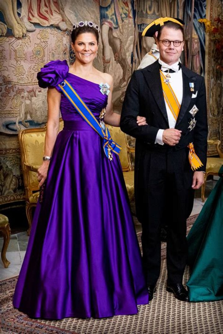 Prince Daniel and Crown Princess Victoria with their daughter on the way to the castle church at the Royal Palace in Stockholm for the wedding between Princess Madeleine and Christopher O'Neill
