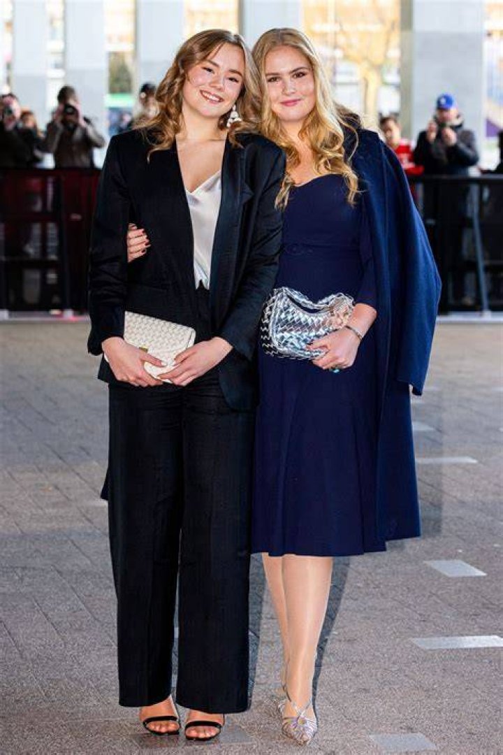 Princess Ariane of the Netherlands with her parents and older sisters during the balcony scene after the abdication of Beatrix in May 2013
