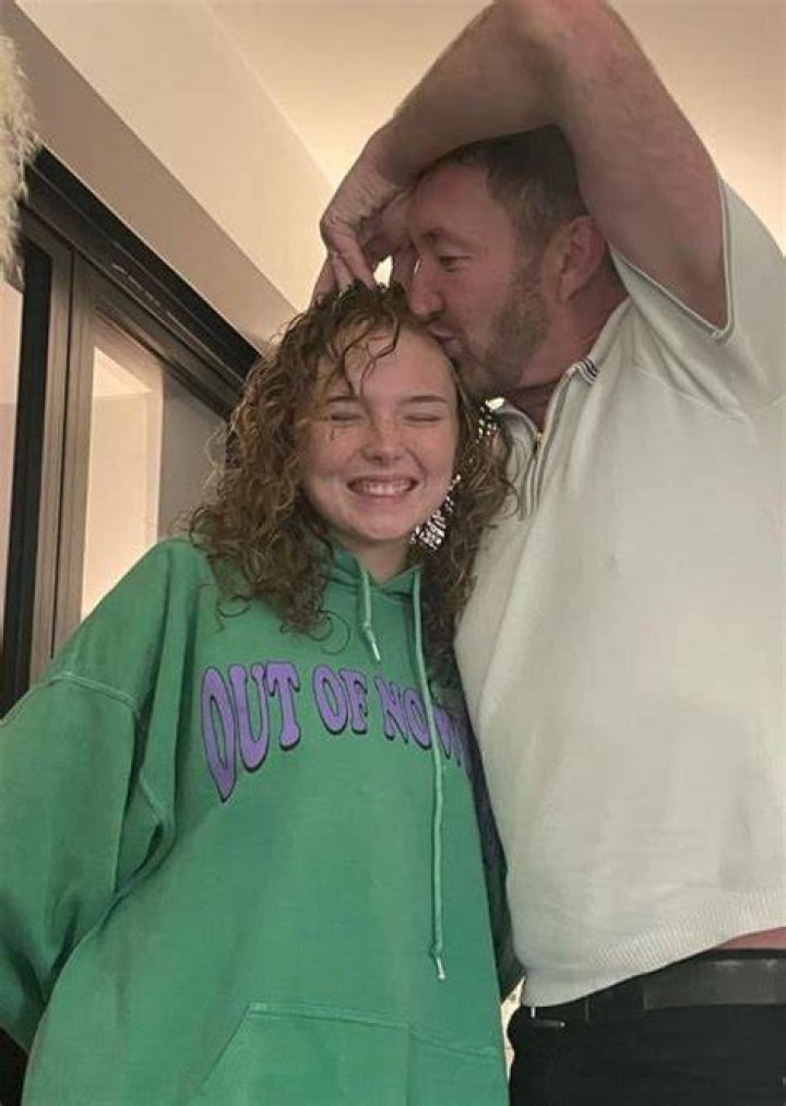 Ralph Ineson pictured while kissing his daughter in January 2022