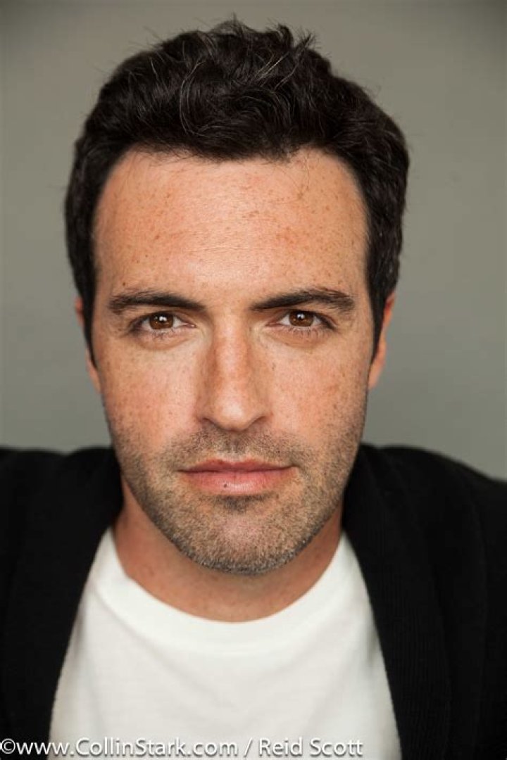 Reid Scott smiling in a picture alongside wife Elspeth Keller Scott