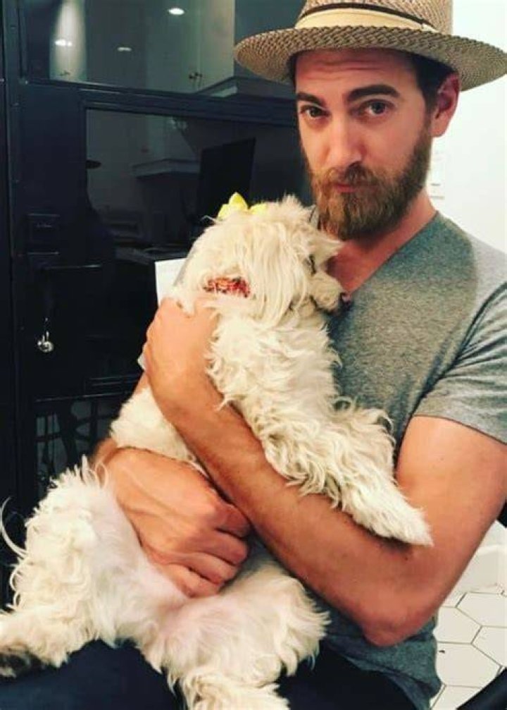 Rhett James McLaughlin with his dog as seen in May 2017
