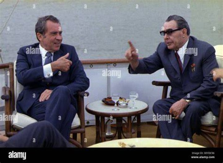 Richard Nixon seen giving his trademark victory sign in 1968