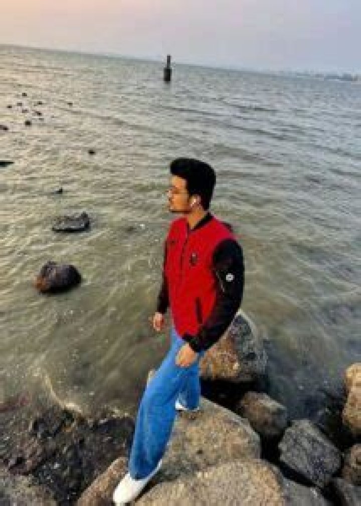 Rishi Singh as seen while smiling for the camera in February 2023
