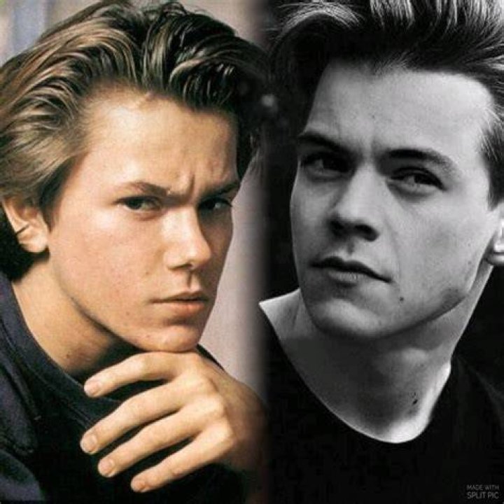 River Phoenix (Left) as seen while posing for the camera along with a fan at the 61st Academy Awards, March 29, 1989 - Governor's Ball