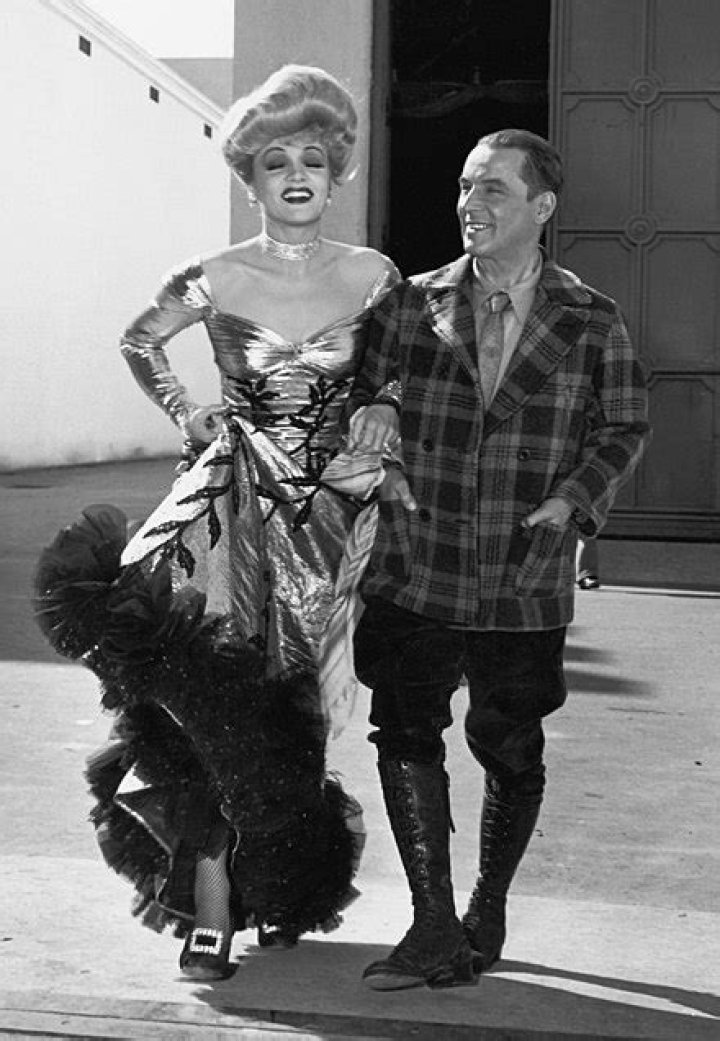 Robert Service with Marlene Dietrich during the filming of The Spoilers (1942)