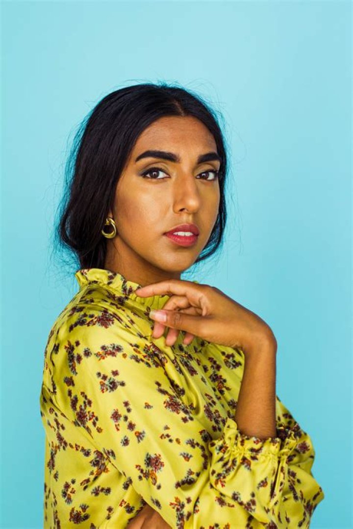 Rupi Kaur posing with her last living grandparent, her maternal grandfather, in her homeland of Punjab, India in April 2018