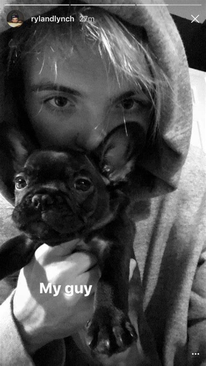 Ryland Lynch with his dog as seen in August 2017