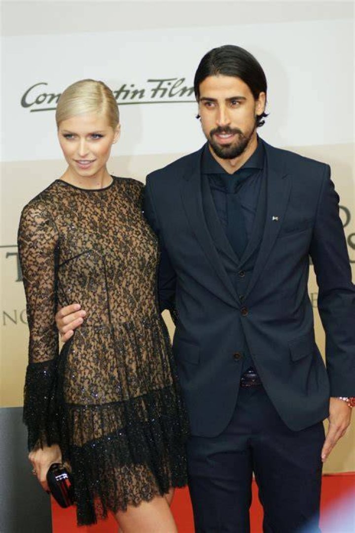 Sami Khedira and Lena Gercke at the Men's Final during Wimbledon Tennis Championships in London in July 2013