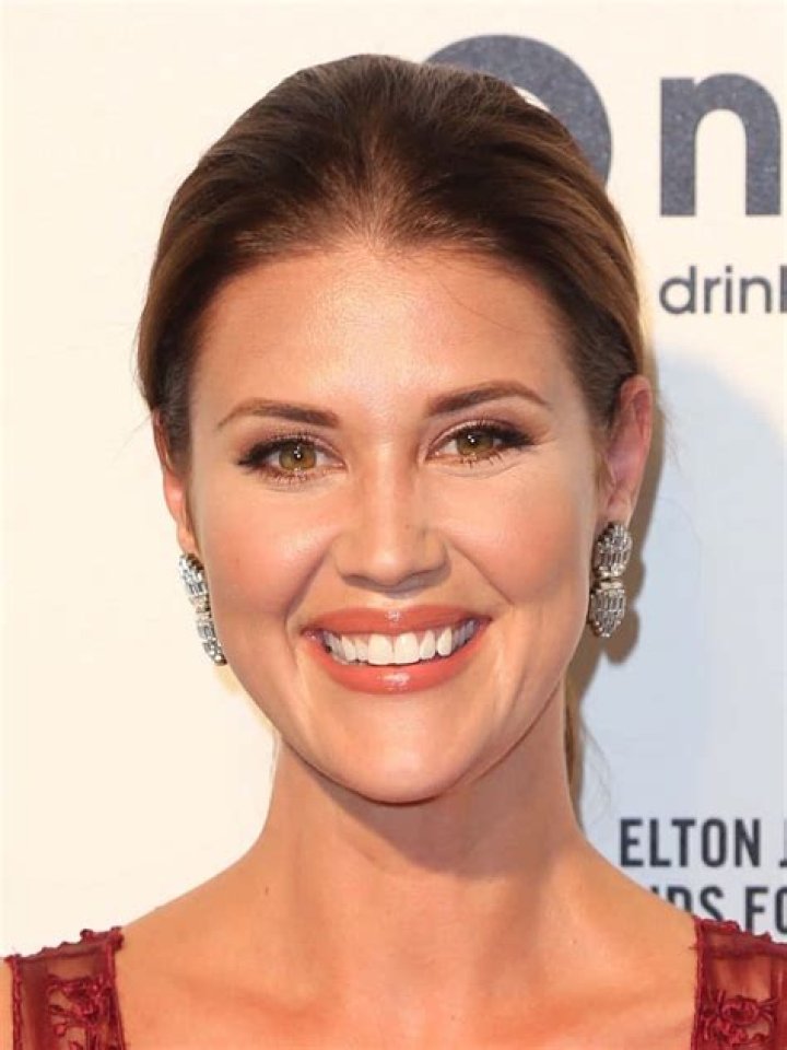 Sarah Lancaster as seen while smiling for the camera at Comic Con 2010