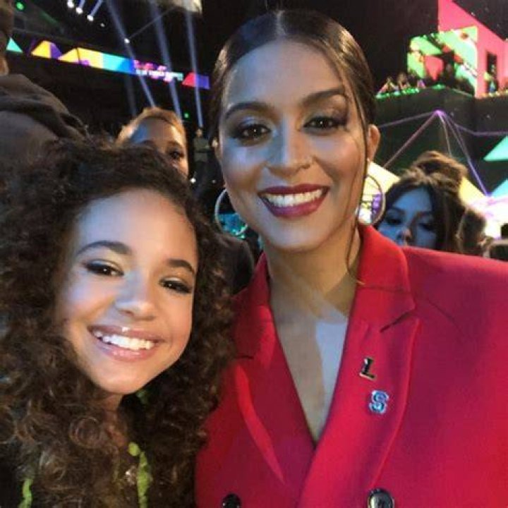 Scarlet Spencer (Left) as seen while posing with the famous YouTuber, Lilly Singh, during a Nickelodeon party in March 2019