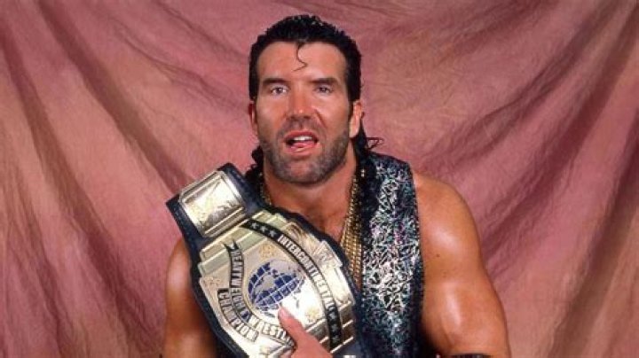 Scott Hall posing with a young fan in April 2018