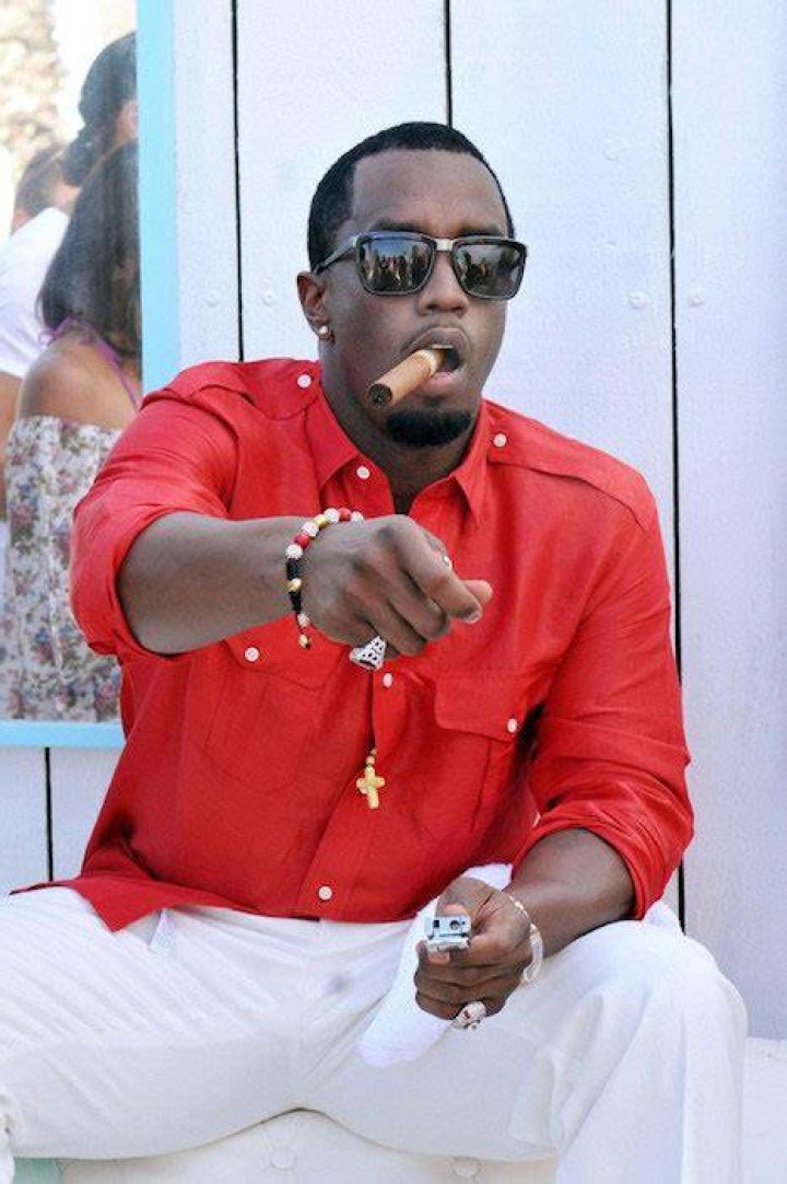 Sean Combs smoking a cigar at Club 55