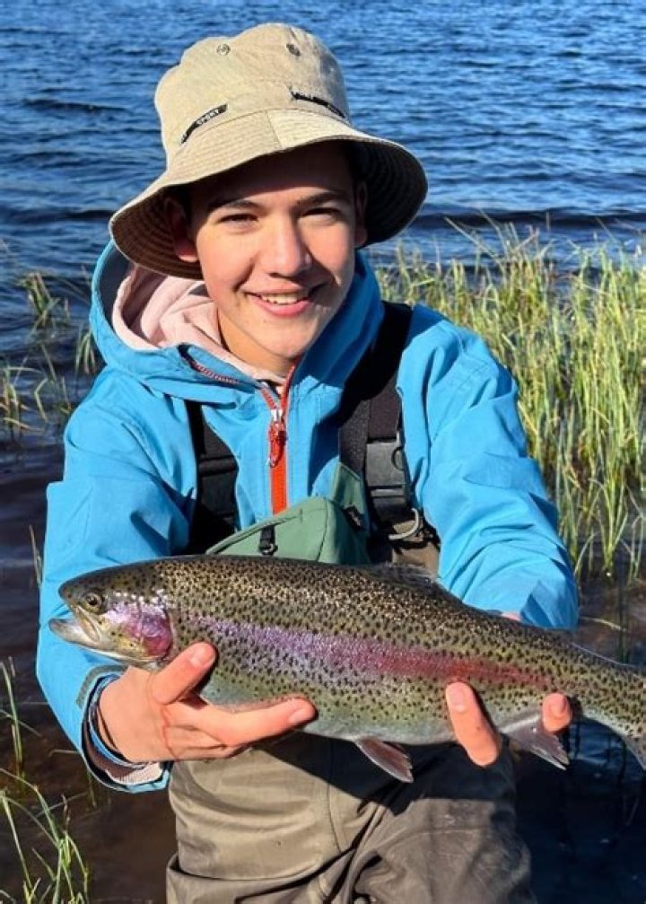 Shae Bennett doing fishing with dad in Scotland