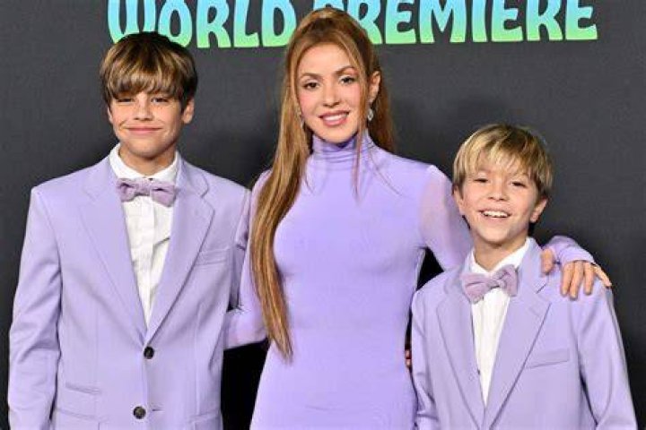 Shakira and her sons Milan (aged two) and-three-month old Sasha in their father's Barca uniform as the family cheered on the home team attending the soccer match of Pique