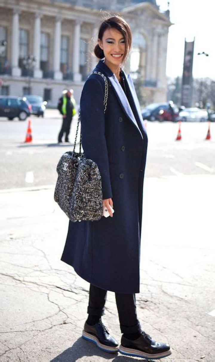 Shu Pei Qin wearing Chanel bag and Prada shoes during Paris Fashion Week.