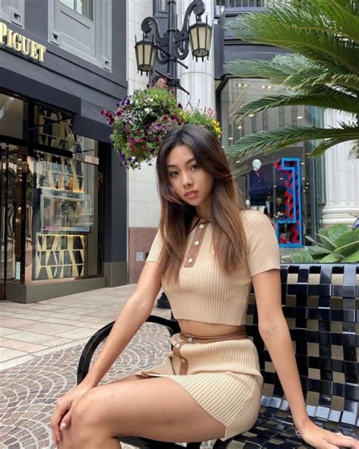 Stacey Kim drinking a hot beverage