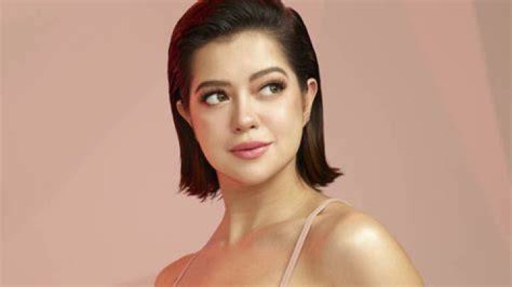 Sue Ramirez posing for the camera in May 2022