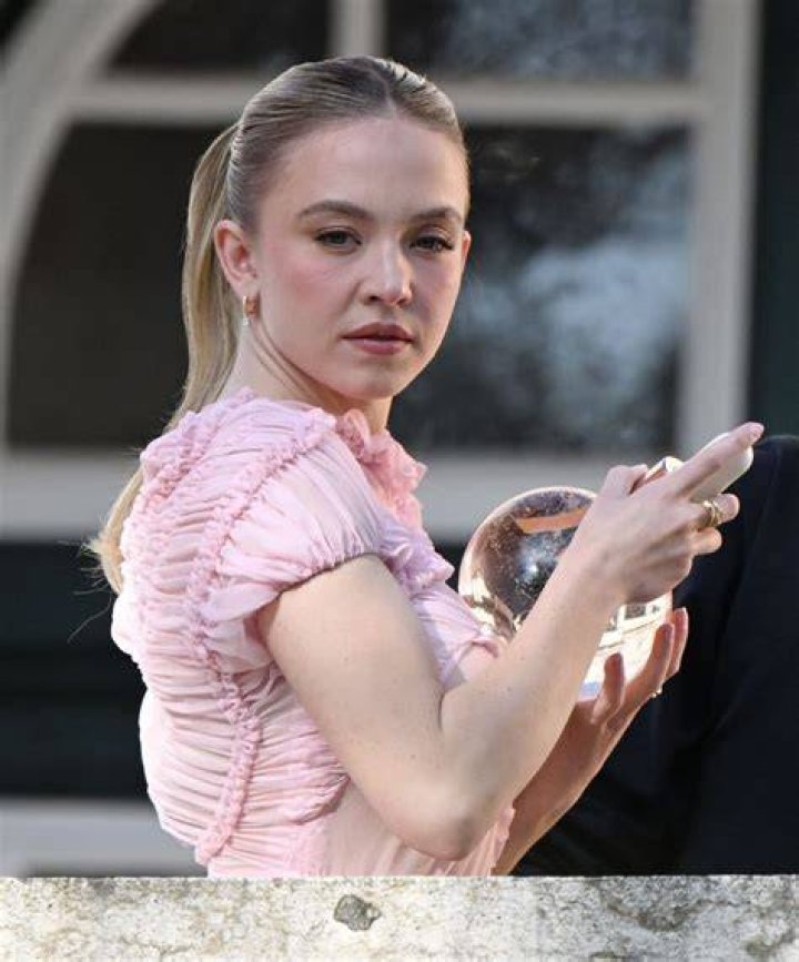 Sydney Sweeney in a March 2023 picture spending time with Ford Cars and her dog