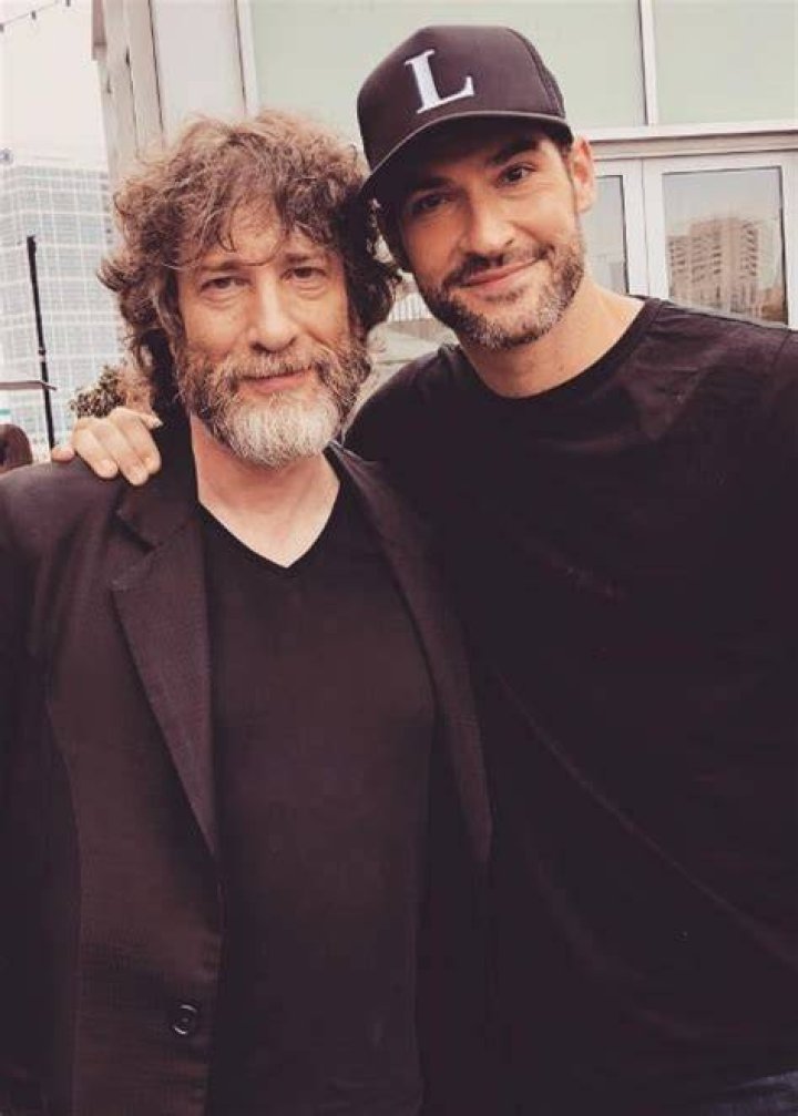 Tom Ellis (Right) as seen while posing for a picture with author Neil Gaiman at the San Diego Comic-Con in San Diego, California in July 2018