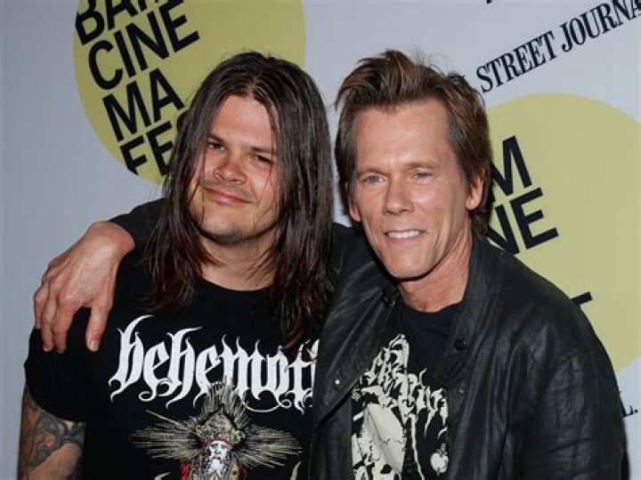 Travis Bacon smiling in a picture alongside his sister at the Roxy Theatre in West Hollywood, California in September 2014