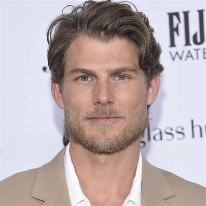 Travis Van Winkle posing for a picture at the Grand Canyon with his dog in June 2020