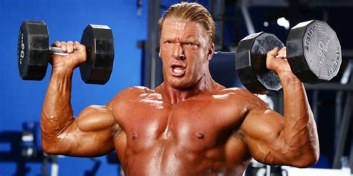 Triple H working out with female partner