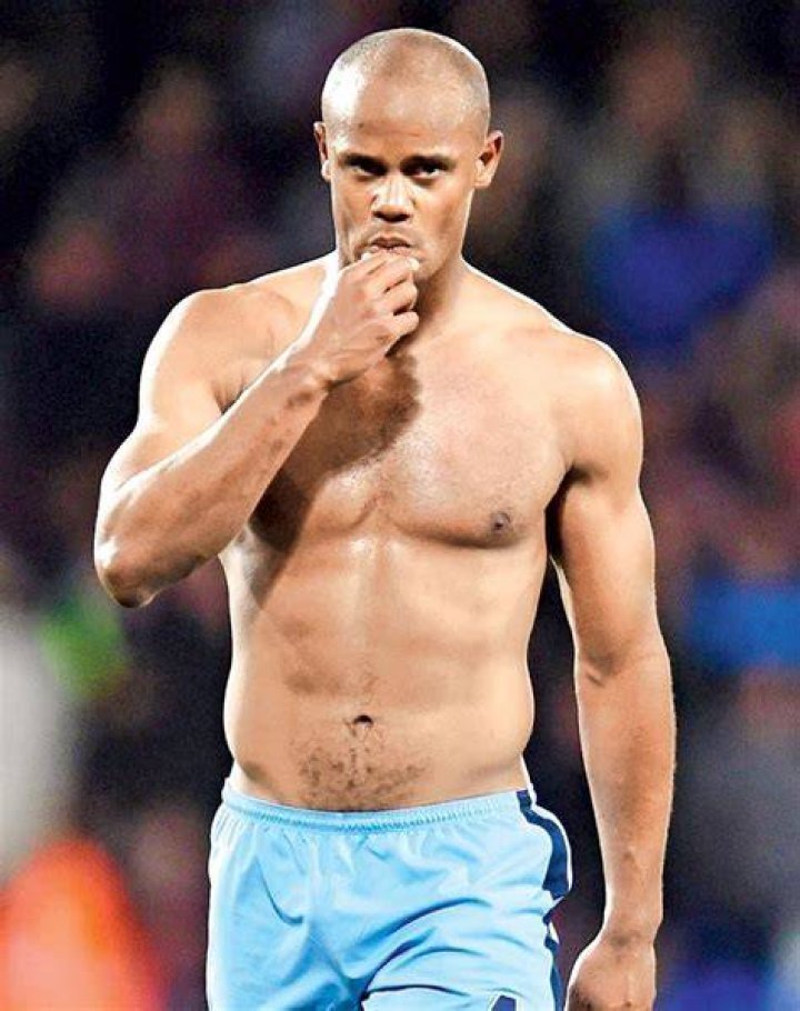Vincent Kompany showing his ripped body after a match