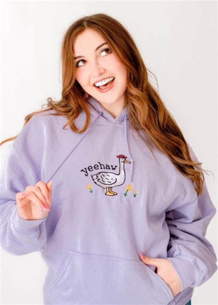 Vixella showing her Yeehaw merchandize in June 2023