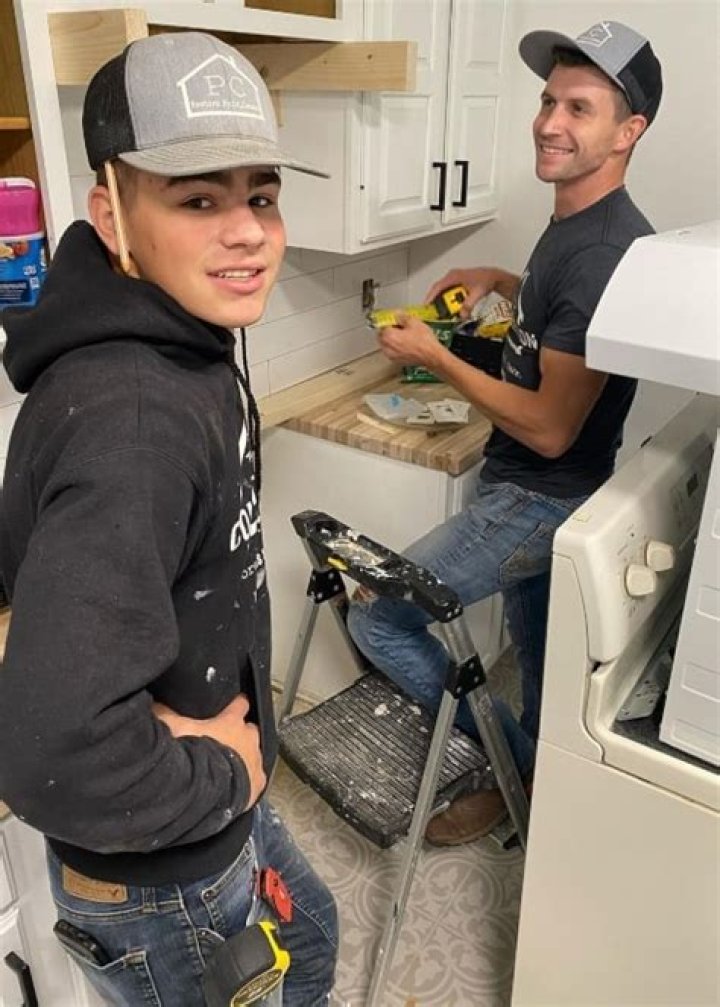 Warden Bates and his brother-in-law Chad Paine while working in October 2020, in Knoxville, Tennesse
