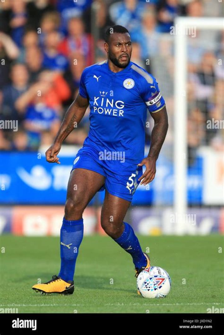 Wes Morgan in duel with Burnley’s player Ashley Barnes in a league match between Leicester City and Burnley on October 4, 2014