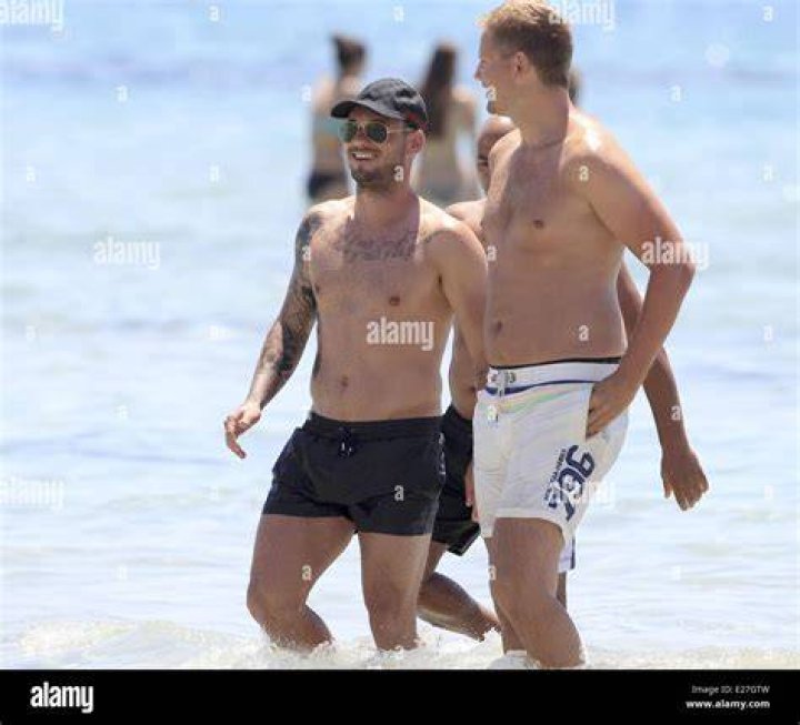 Wesley Sneijder and his wife Yolanthe Cabau van Kasbergen during vacation on Ibiza
