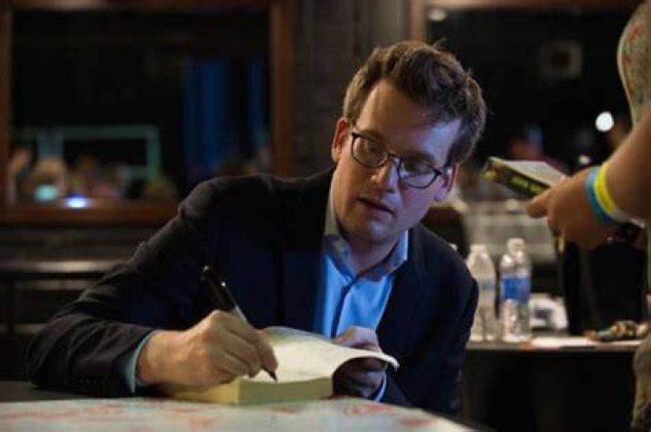 Writer John Green signing autographs for fans on his &lsquo;Get Lost Get Found&rsquo; tour in Dallas, Texas in June 2015