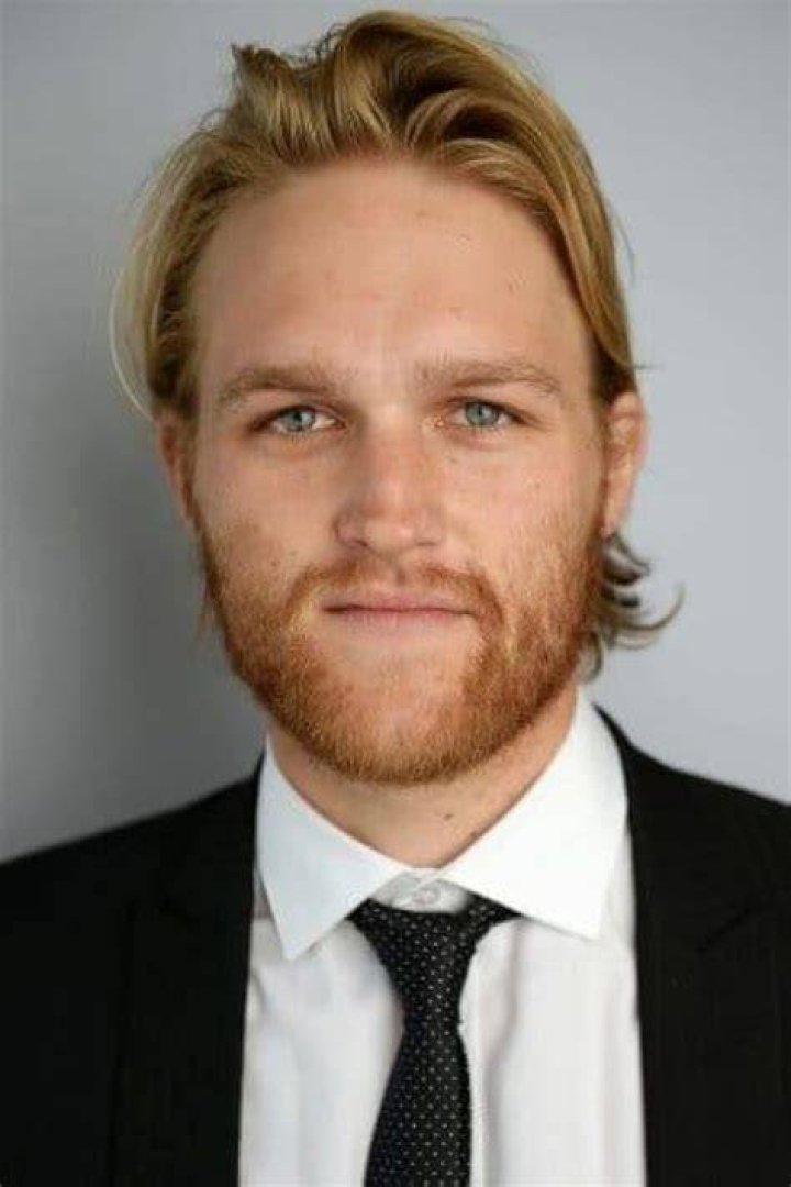 Wyatt Russell smiling in a picture with a wild chipmunk posing between his legs in Big Sur, California in June 2019