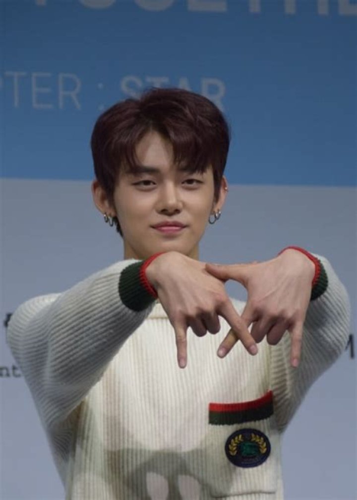 Yeonjun as seen while posing for a picture at Tomorrow X Together's debut showcase in March 2019